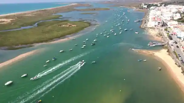 Santa Luzia seen from the Ria Formosa, with boats and houses